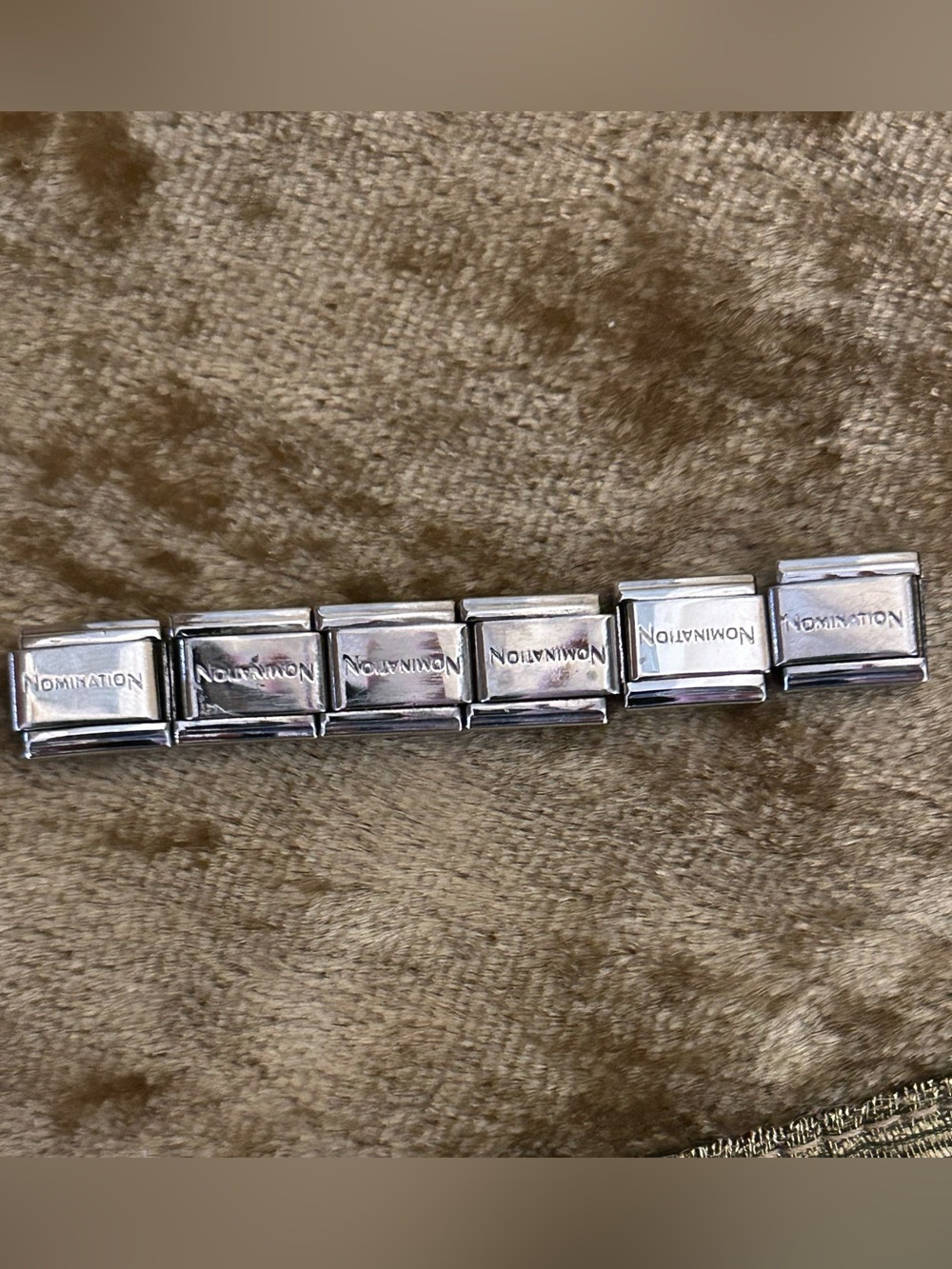 6 Nomination Italian Charms with the word nomination on each